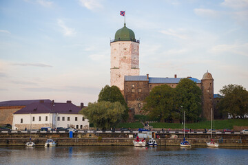 Obraz premium View of the Vyborg Castle from the South Harbor on an October evening. Leningrad region, Russia