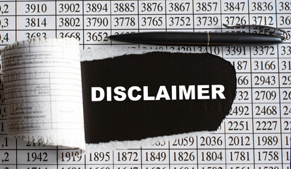 DISCLAIMER is the word behind torn office paper with numbers and a black pen.