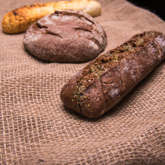 Rye bread,a loaf of white and rye bread on the table close-up,with space for text