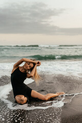 woman on beach is enjoying serene ocean nature during travel holidays vacation outdoors sunset time