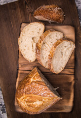 White bread sliced on a chopping Board close-up,with space for text