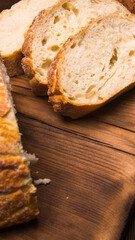 White bread sliced on a chopping Board close-up,with space for text