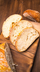White bread sliced on a chopping Board close-up,with space for text