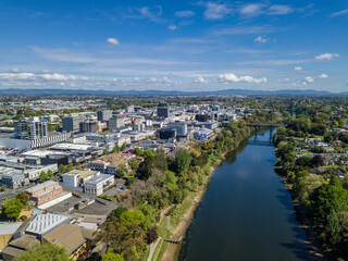 Aerial drone view looking towards the CBD as the Waikato River cuts through the city of Hamilton, in the Waikato region of New Zealand
