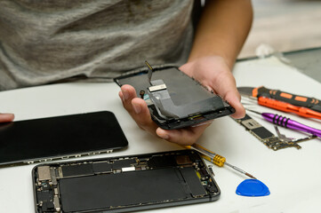 Close-up photos showing process of mobile phone repair.Mobile phone repair
