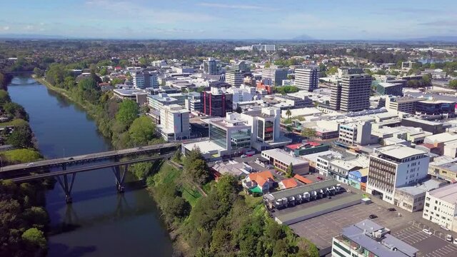 Aerial drone footage above the Waikato River looking South towards the CBS over Hamilton City in the Waikato region of New Zealand (Aotearoa)