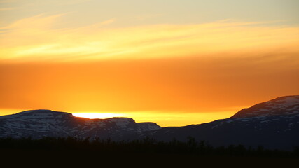 Orange sunset in Norrbotten in northern Sweden