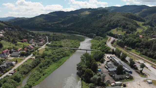 Poprad River in sunny day in summer near village Rytro. Beskid Sadecki Mountains, Poland.