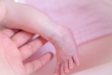 Fototapeta premium Close-up background of newborn hands or feet requiring close supervision