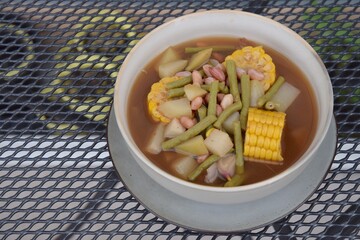 Sayur asem or sayur asam is a popular Indonesian vegetable in tamarind soup. Common ingredients are peanuts, young jackfruit, corn, melinjo,  chayote and long bean.