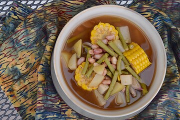 Sayur asem or sayur asam is a popular Indonesian vegetable in tamarind soup. Common ingredients are peanuts, young jackfruit, corn, melinjo,  chayote and long bean.