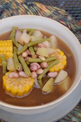 Sayur asem or sayur asam is a popular Indonesian vegetable in tamarind soup. Common ingredients are peanuts, young jackfruit, corn, melinjo,  chayote and long bean.