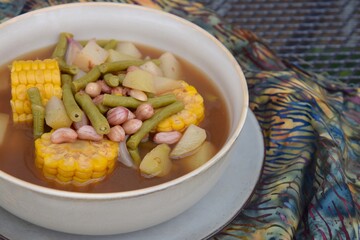 Sayur asem or sayur asam is a popular Indonesian vegetable in tamarind soup. Common ingredients are peanuts, young jackfruit, corn, melinjo,  chayote and long bean.