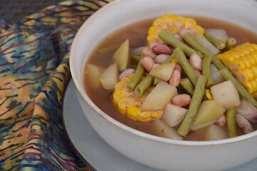 Sayur asem or sayur asam is a popular Indonesian vegetable in tamarind soup. Common ingredients are peanuts, young jackfruit, corn, melinjo,  chayote and long bean.