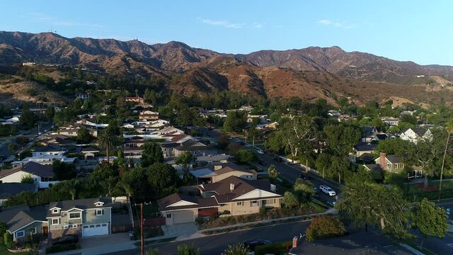 Drone view of beautiful neighborhood in the hills at sundown