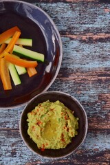 Avocado hummus with zucchini bell pepper veggie sticks