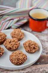 Quinoa puff almond butter chocolate sweet dessert served with hot tea