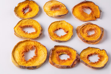 slices of dried peach on a white background. dried fruits. eco. top view.