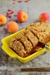 Apricot walnut goji berry oat loaf cake. Selective focus