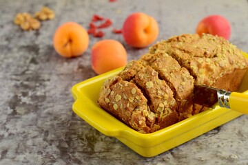Apricot walnut goji berry oat loaf cake. Selective focus