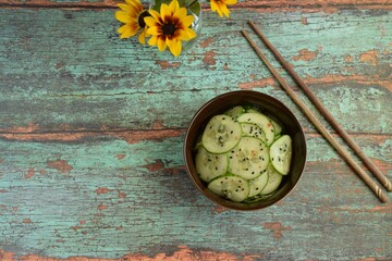 Asian cucumber salad with black sesame seeds and chili flakes