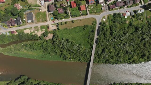 Village Sucha Struga and Poprad River in summer. Beskid Sadecki Mountains, Poland.