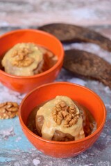 Banana chocolate peanut butter ice cream with walnut. Selective focus