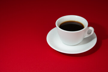 cup of coffee on the red background. Americano.