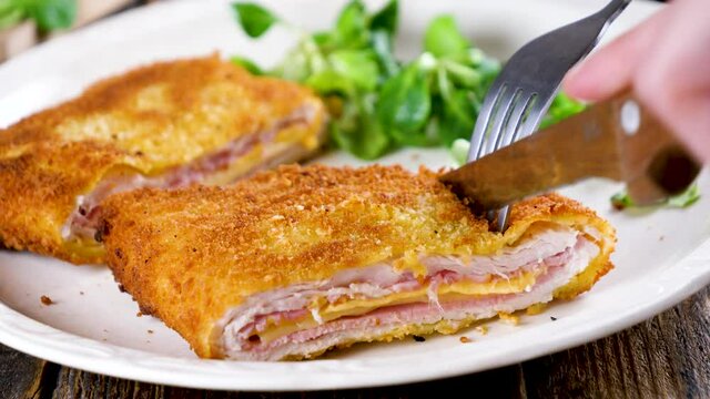 eating cordon bleu food and lettuce