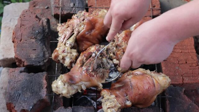 boar knee on an open fire on a sunny day