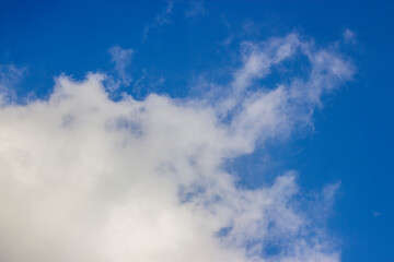 Soft white clouds and blue sky background.