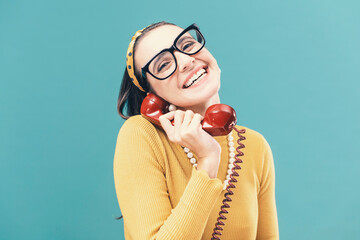 Cheerful vintage style woman on the phone
