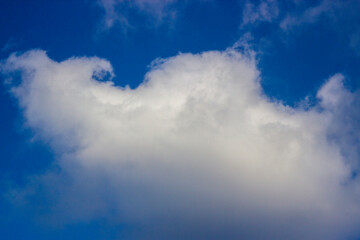 Soft white clouds and blue sky background.