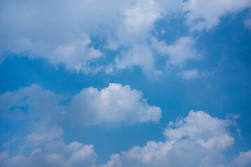 Soft white clouds and blue sky background.