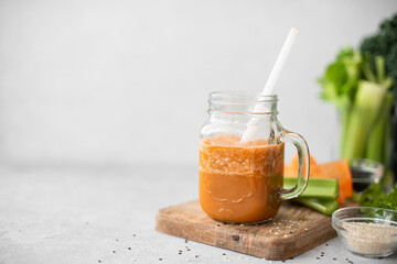 carrot and celery vegetable smoothie with sesame seeds