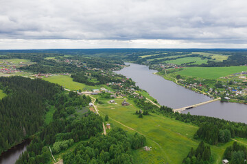 Aerial view of the Khokhlovka on the river of Kama. Perm Krai, Russia. River mouth, a village in Russia.