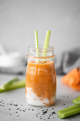 carrot smoothie with sour cream and sesame seeds