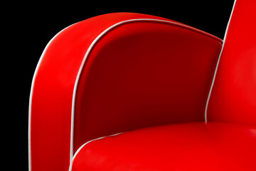 Fototapeta na wymiar Part of luxury red armchair and white edgings isolated on black background
