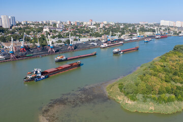 Fototapeta na wymiar Don river, barges, port and cranes, coal loading, aerial view.