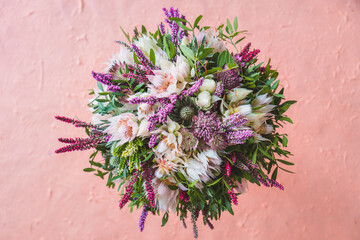 Beautiful autumn, wedding bouquet made out of a sortiment of sessional flowers, such as Calluna...
