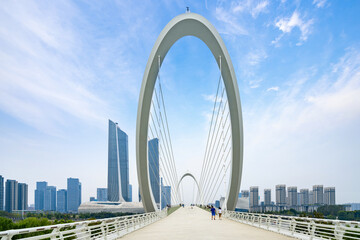 Obraz premium Eye of Nanjing Pedestrian Bridge and urban skyline in Nanjing, China