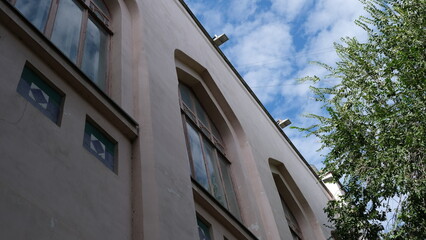 Obraz premium Details and elements of the facade of the building. Russian architecture, background image for web design.