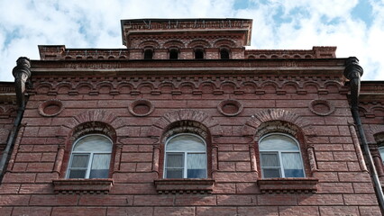 Fototapeta premium Details and elements of the facade of the building. Russian architecture, background image for web design.