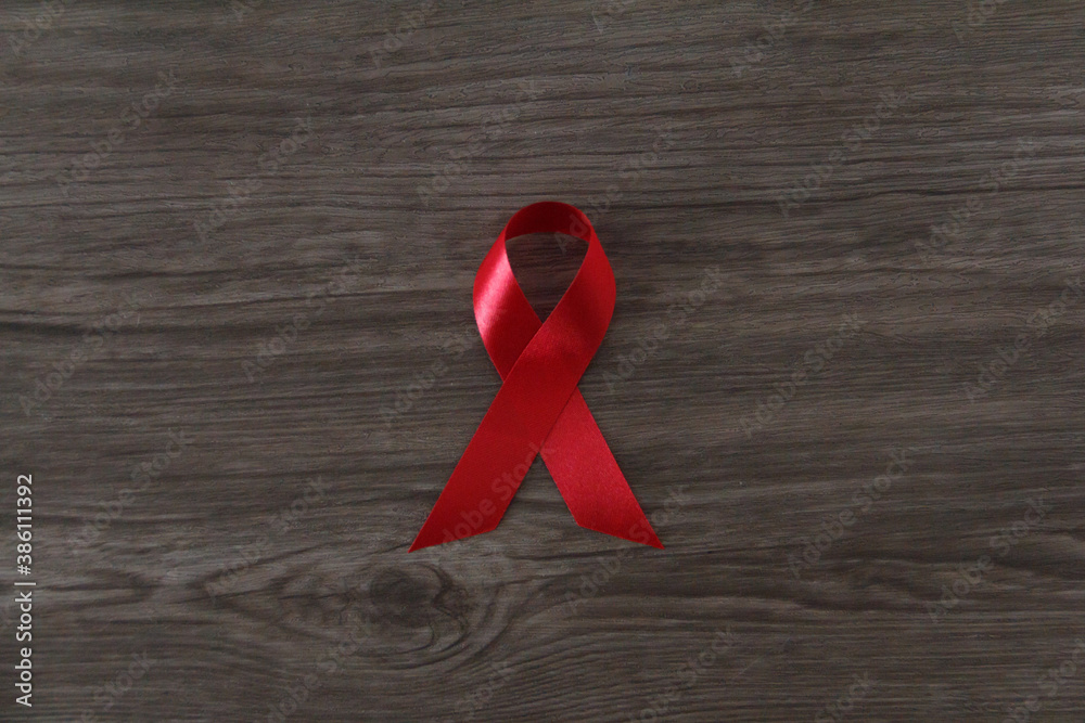 Wall mural red AIDS awareness ribbon. World aids day and healthcare and medicine concept