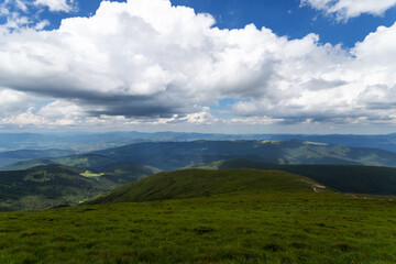 Beautiful low clouds over the mountains. Mountain landscape.