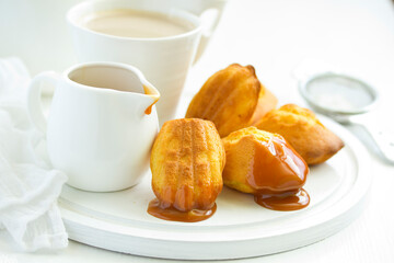 Madeleine french cookies with caramel. selective focus.