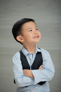 Asian boy, dressed smartly, looking intellectual
