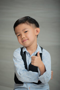 Asian boy, dressed smartly, looking intellectual
