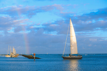 Sailboat and rainbow, Honolulu, Hawaii