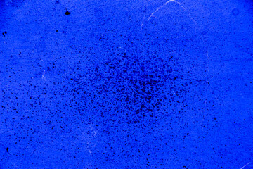 Fototapeta na wymiar Blue colored wall texture background with textures of different shades of blue and dotted in the center